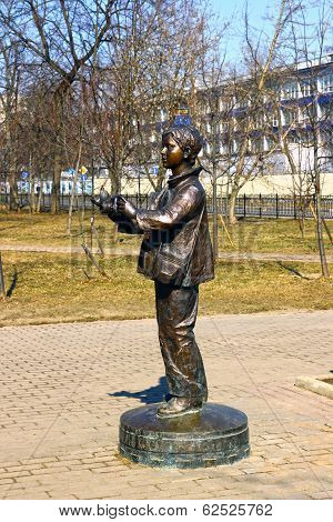 Monument To Boy Photographer With A Camera From Which A Bird Flies