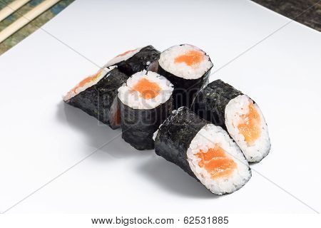 Makisushi On White Plate. Seafood Traditional Maki Sushi Rolls With Chopsticks