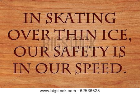 In skating over thin ice, our safety is in our speed - quote by Ralph Waldo Emerson on wooden red oak background