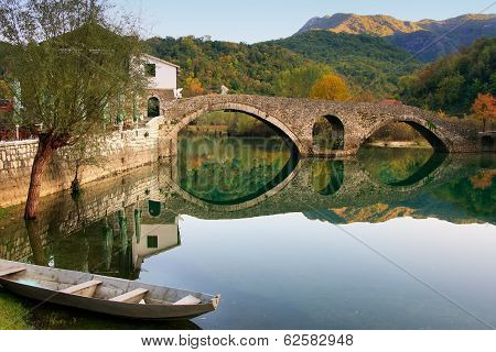 Arched Bridge Reflected In Crnojevica River, Montenegro