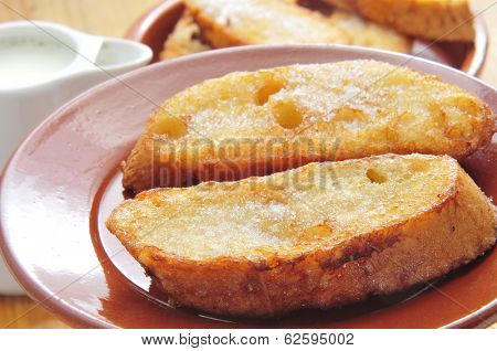 closeup of a plate with torrijas, typical spanish dessert for Lent and Easter