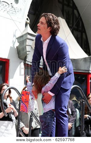 LOS ANGELES - APR 2:  Orlando Bloom, Flynn Bloom at the Orlando Bloom Hollywood Walk of Fame Star Ceremony at TCL Chinese Theater on April 2, 2014 in Los Angeles, CA