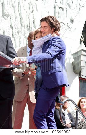 LOS ANGELES - APR 2:  Orlando Bloom, Flynn Bloom at the Orlando Bloom Hollywood Walk of Fame Star Ceremony at TCL Chinese Theater on April 2, 2014 in Los Angeles, CA
