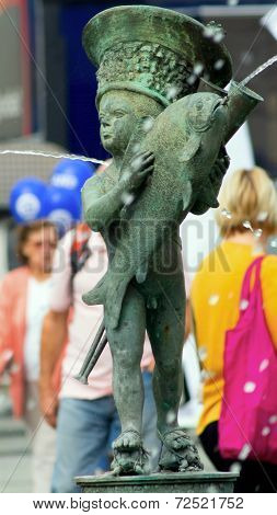 Fountain - small boy with fish standing on two small turtles