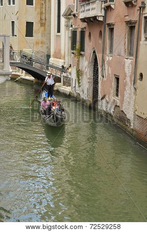 Gondola Crossing A Small Canal