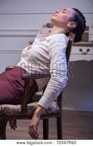 Serious woman wearing white blouse