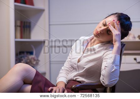 Serious woman wearing white blouse