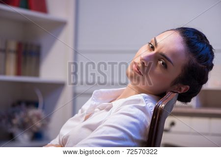 Serious woman wearing white blouse