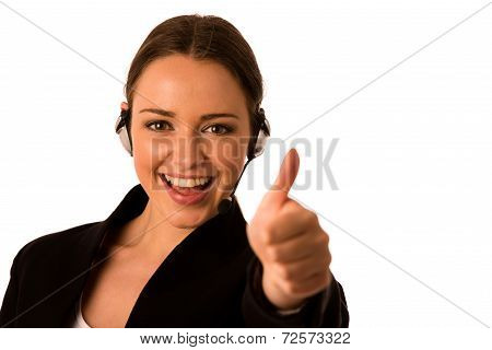 Preety Happy Asian Caucasian Business Woman With Headset Showing Thumb Up As A Gesture For Success