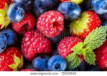 Berry fruits on wooden background