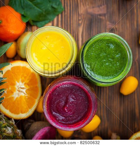 Blended Green,yellow And Purple Smoothie With Ingredients