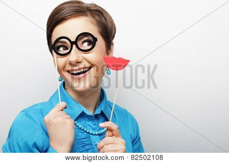 Attractive playful young woman ready for party - falce lips and glasses   
