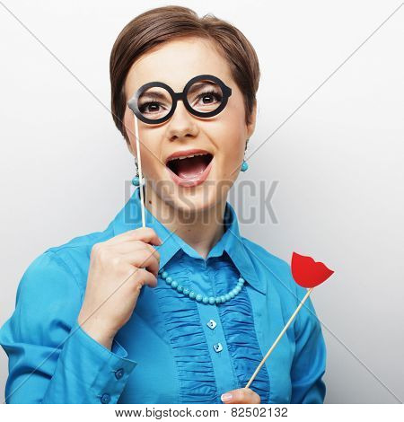 Attractive playful young woman ready for party - falce lips and glasses   