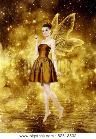 Beautiful Young Brunette Woman As Golden Fairy