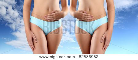 woman hands on belly