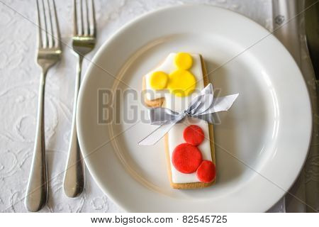 number one shaped birthday cake with baw in white plate