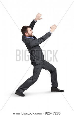 young man holding empty copycpace and screaming. isolated on white background