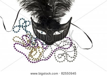 Shiny Gold, Purple, Blue And Silver Beads And Mardi Gras Mask With Feathers On A White Background. S