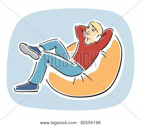 Young blond guy resting on a bean bag chair