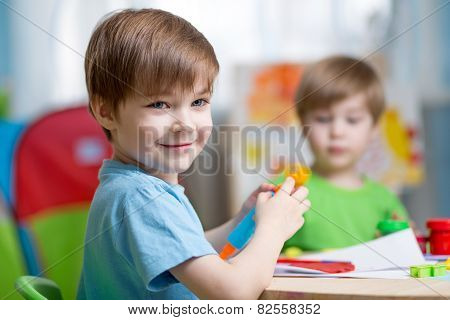 kids with play clay at home