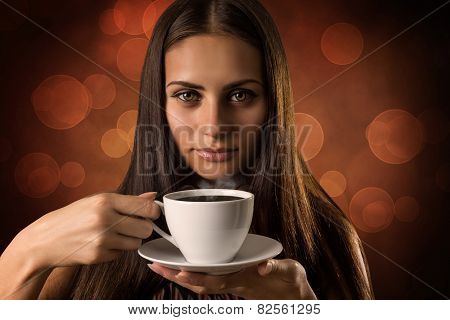 The girl with cup of coffee
