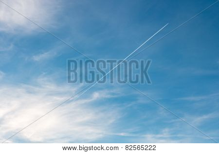 Airplane emerging from the clouds