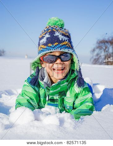 Little boy in winter park