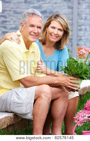 Senior couple at new home. Retirement security concept.