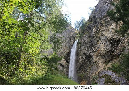 Waterfall Through Rocks In Madesimo