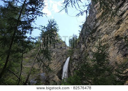 Waterfall Through Rocks In Madesimo