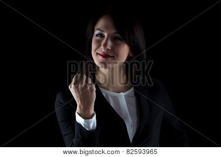 Photo of smiling business woman showing fist