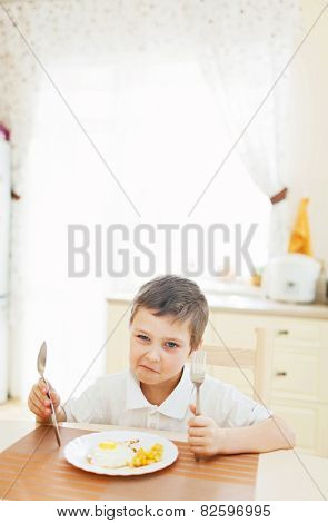 Portrait of little boy in the kitchen