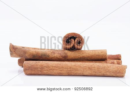 Group Of Dried Cinnamon Stics On White Background