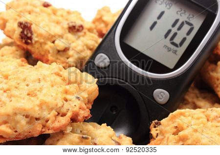 Glucometer And Oatmeal Cookies On White Background