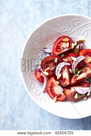 Mediterranean tomato salad with pine nuts and capers