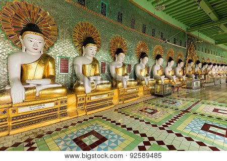 Golden Buddha statues row in the U-Min Thonze pagoda, Sagaing, Myanmar (Burma)