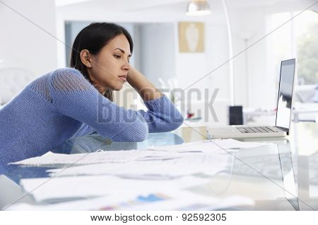 Stressed Woman Working At Laptop In Home Office