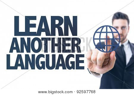 Business man pointing the text: Learn Another Language