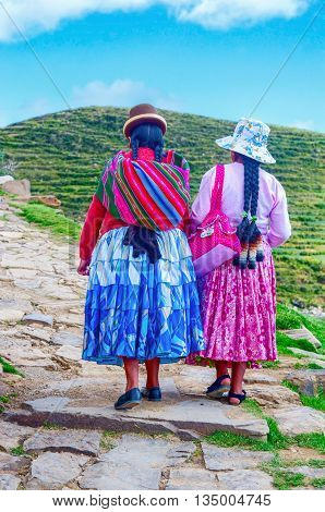 Island of the Sun Bolivia-March 22 2015: Bolivian women in traditional clothes on the street .