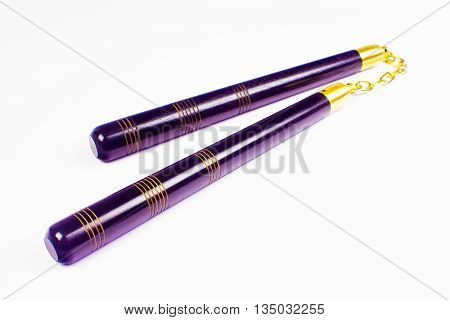 Purple nunchaku the asian weapon isolated on white background.