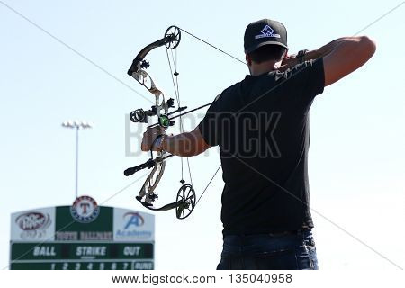 ARLINGTON, TX - APR 18: Recording artist Luke Bryan paticipates at the ACM & Cabela's Great Outdoor Archery Event at the Texas Rangers Youth Ballpark on April 18, 2015.