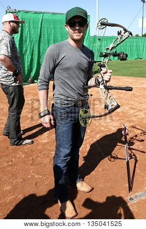 ARLINGTON, TX - APR 18: Recording artist Justin Moore poses at the ACM & Cabela's Great Outdoor Archery Event at the Texas Rangers Youth Ballpark on April 18, 2015.