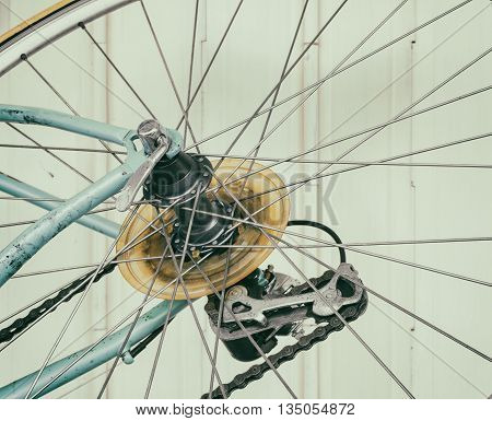 Part of old bicycle wheel derailleur and chain (vintage effect)