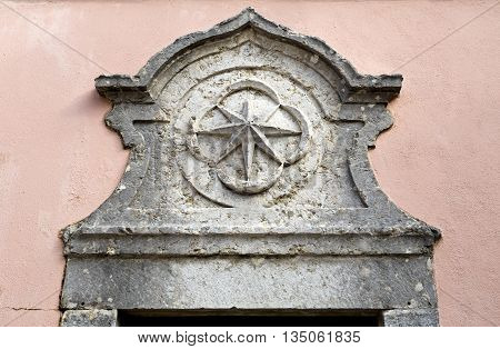 OEIRAS, PORTUGAL - November 4, 2015: Detail of the star on top of the door to the former guardhouse in the courtyard of the Palace of Oeiras on November 4, 2015 in Oeiras, Portugal