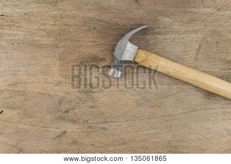 samall hammer equipment on wood background  wooden