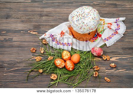 Homemade Easter cake and painted eggs on the table
