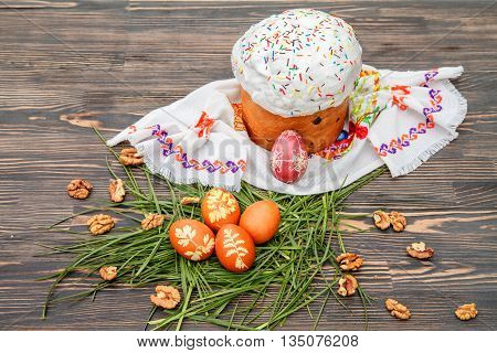 Homemade Easter cake and painted eggs on the table