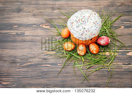 Homemade Easter cake and painted eggs on the table