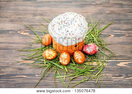 Homemade Easter cake and painted eggs on the table