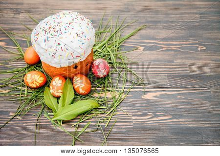 Homemade Easter cake and painted eggs on the table